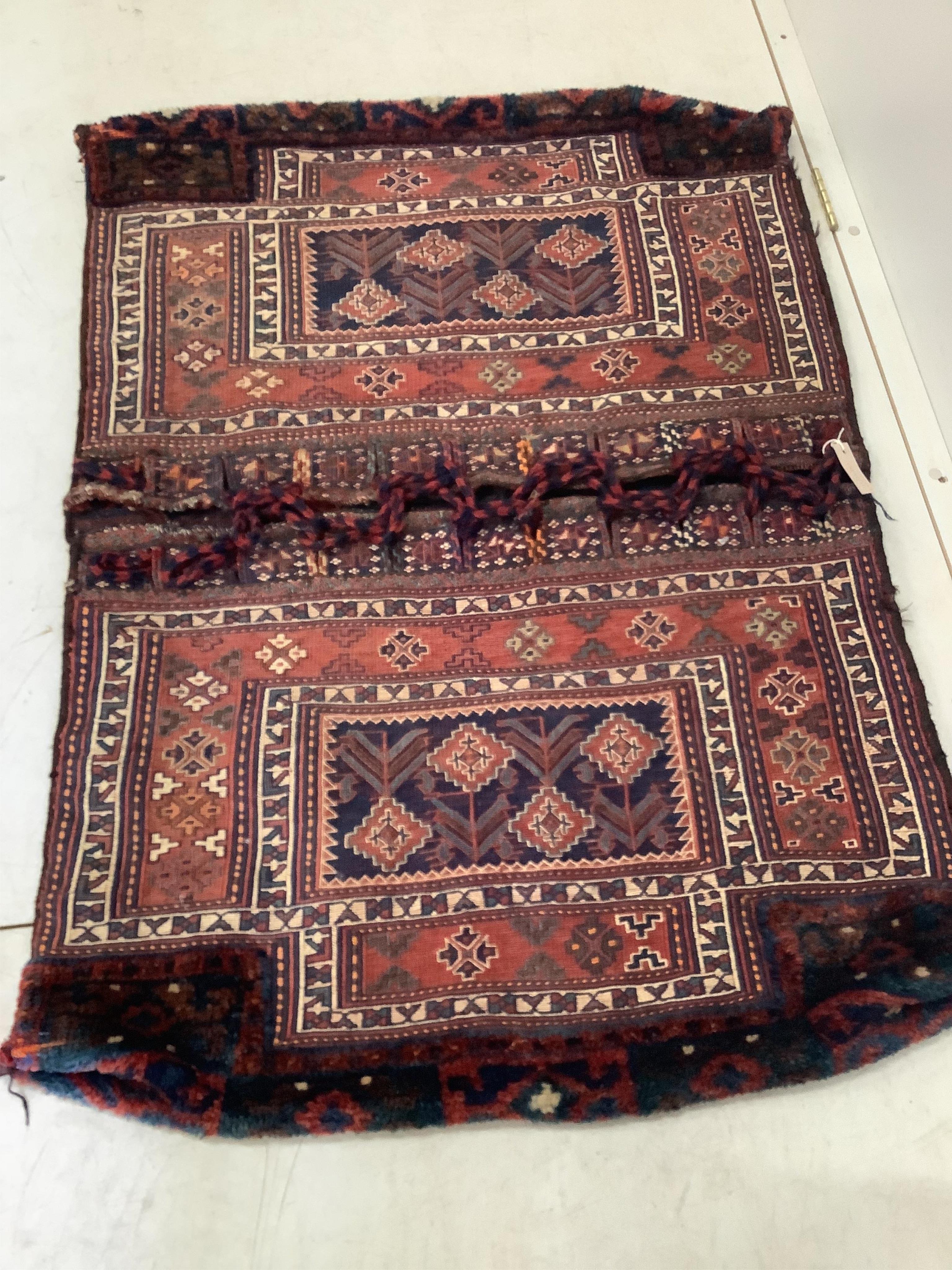A Soumak double saddle bag and a similar salt bag, larger 128 x 90cm. Condition - fair to good